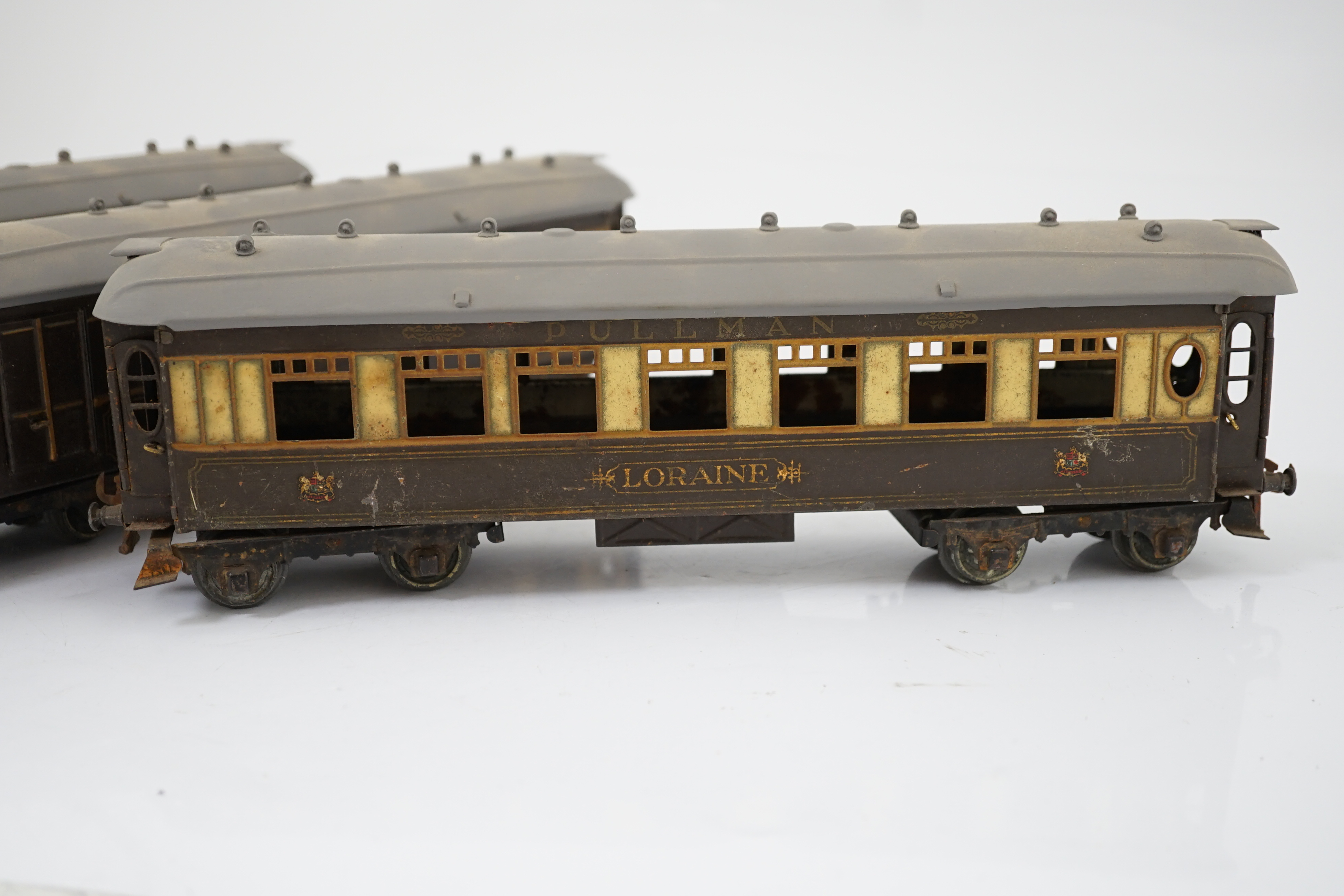 Three Hornby Series 0 gauge tinplate Pullman cars; Loraine, Arcadia and Montana